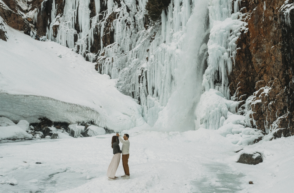 couple dancing under waterfall